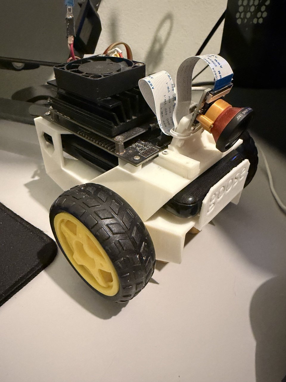 JetBot from the side, showing the Jetson Nano, fisheye camera and 3D-printed body